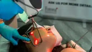 Provider performing Fotona 4D Laser Facelift treatment for non-invasive skin tightening and rejuvenation.