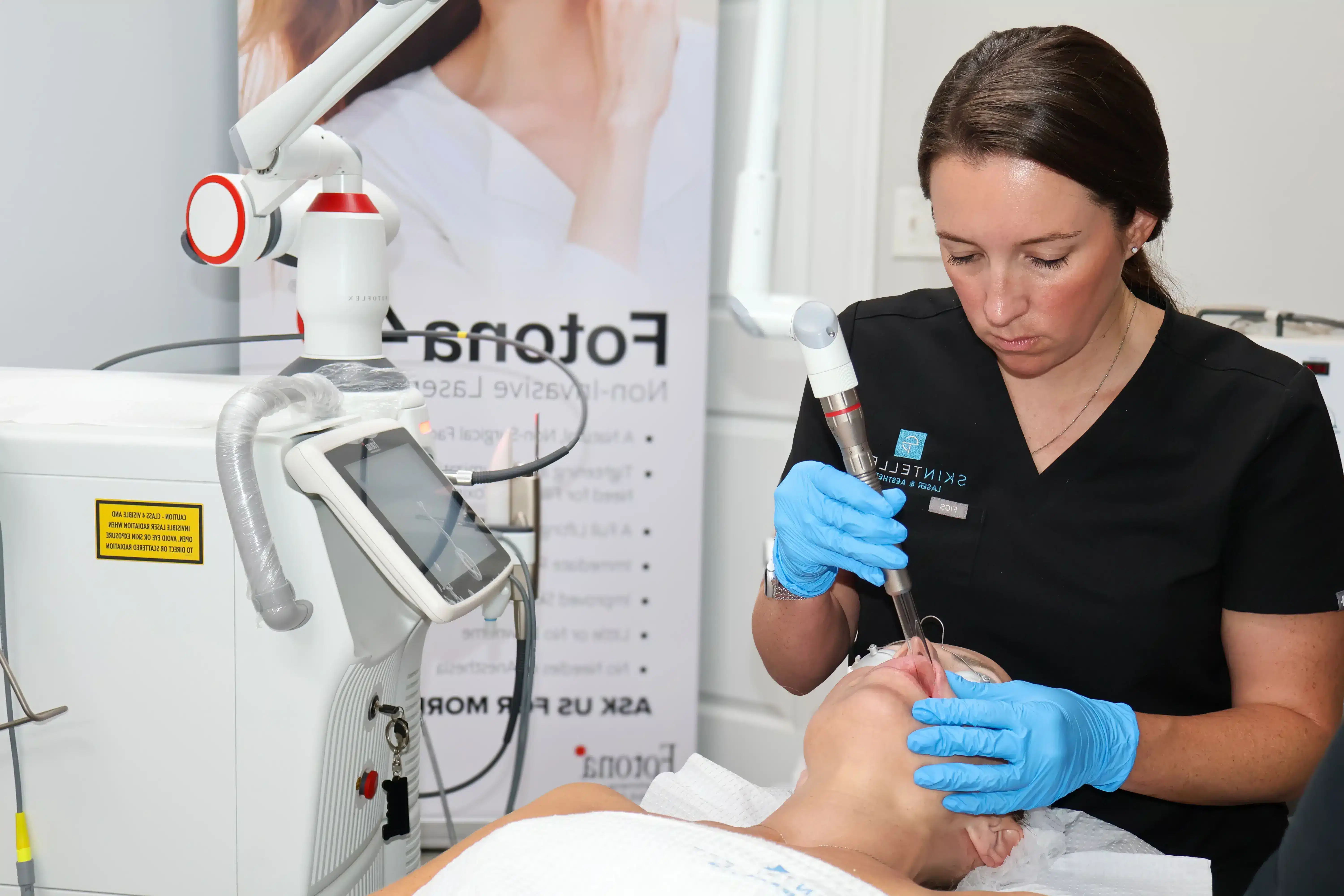 Patient receiving Fotona 4D Laser treatment targeting facial wrinkles and sagging skin.