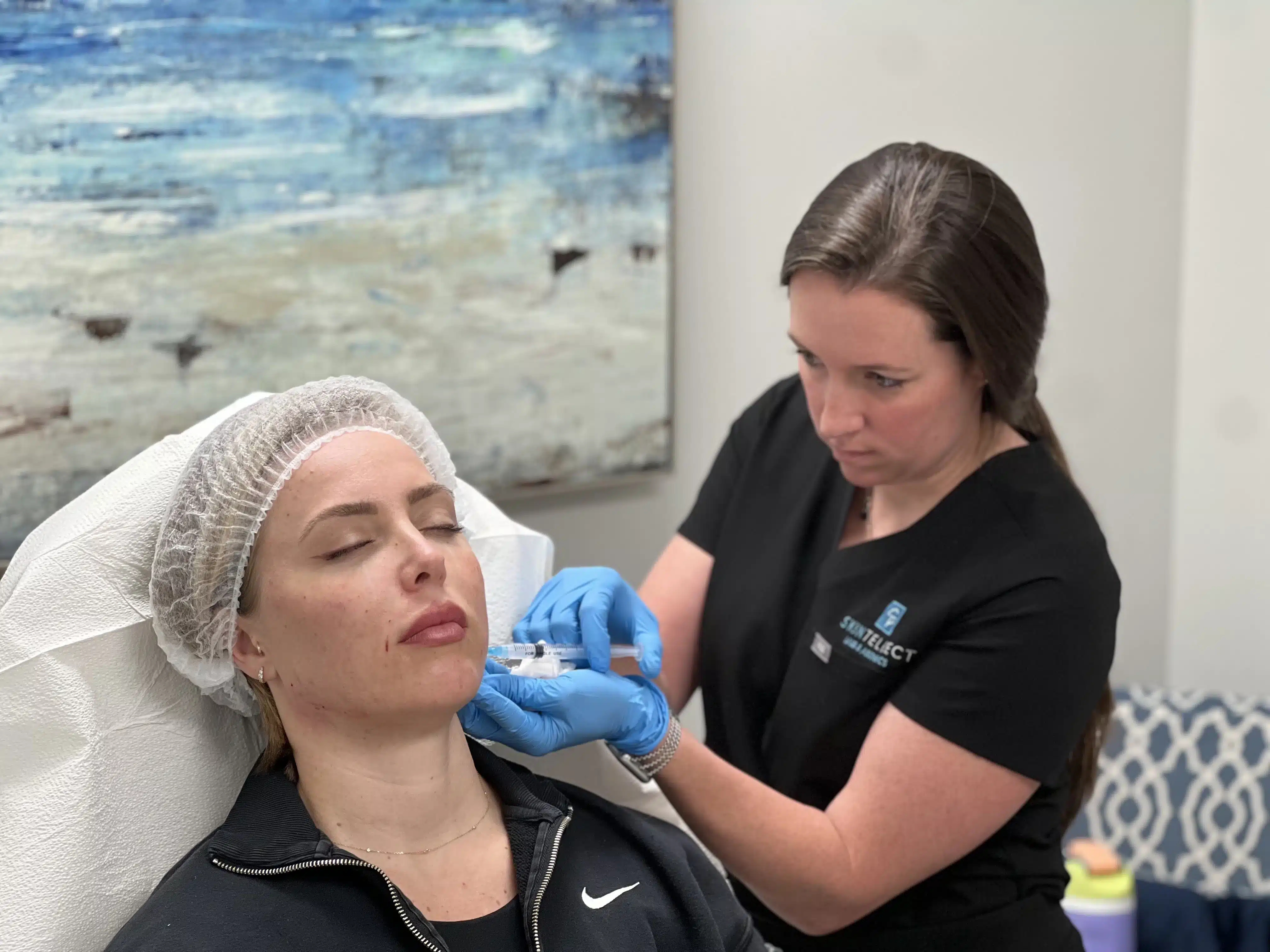 Patient undergoing Sculptra treatment to stimulate collagen production and restore facial volume.