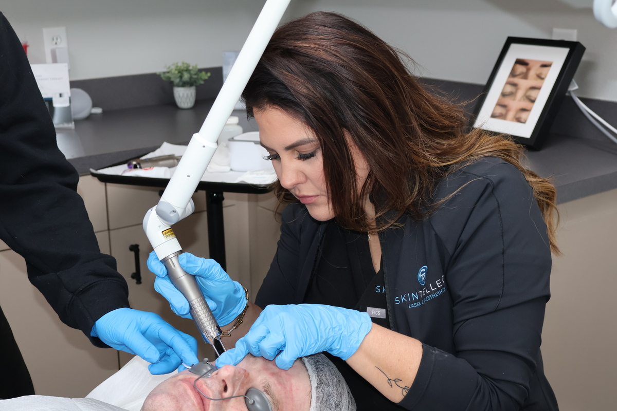 Patient receiving Fotona SmoothEye® laser treatment for non-surgical under eye tightening, wrinkle reduction, and collagen stimulation at Skintellect Laser & Aesthetics.